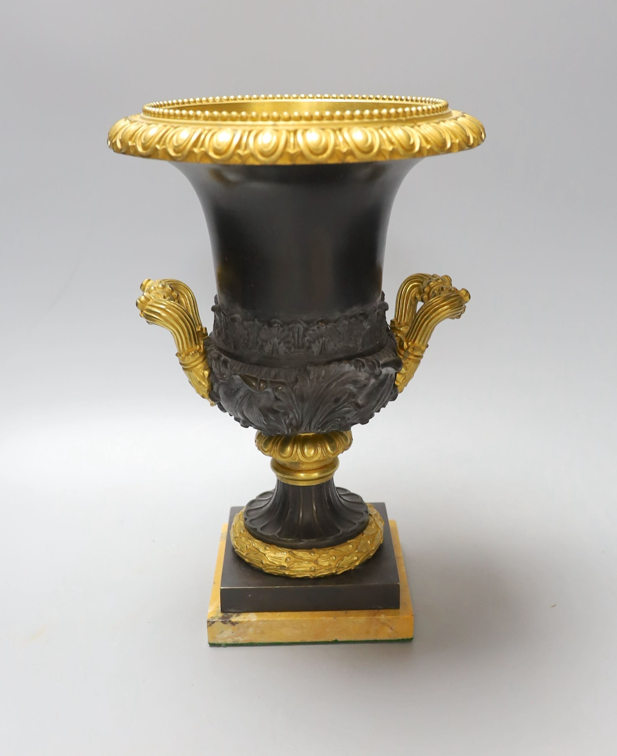 A Louis XVI style campana-shape bronze and ormolu urn, 28cm